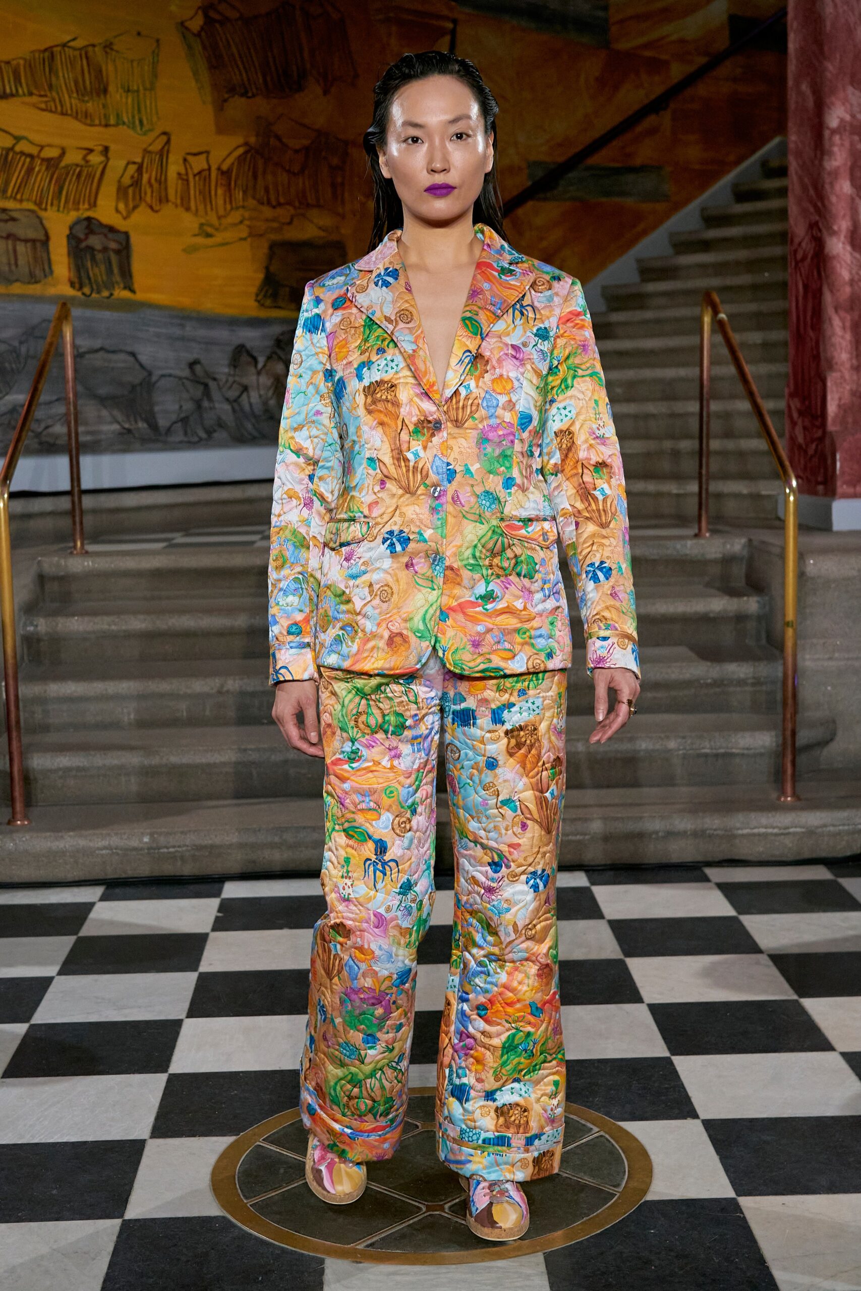 A fitted multicolor silk suit with a long-sleeve collared jacket and printed design.