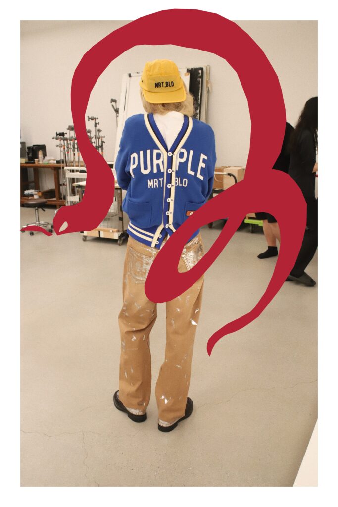 An oversized blue jacket paired with beige pants, creating a casual yet stylish look.