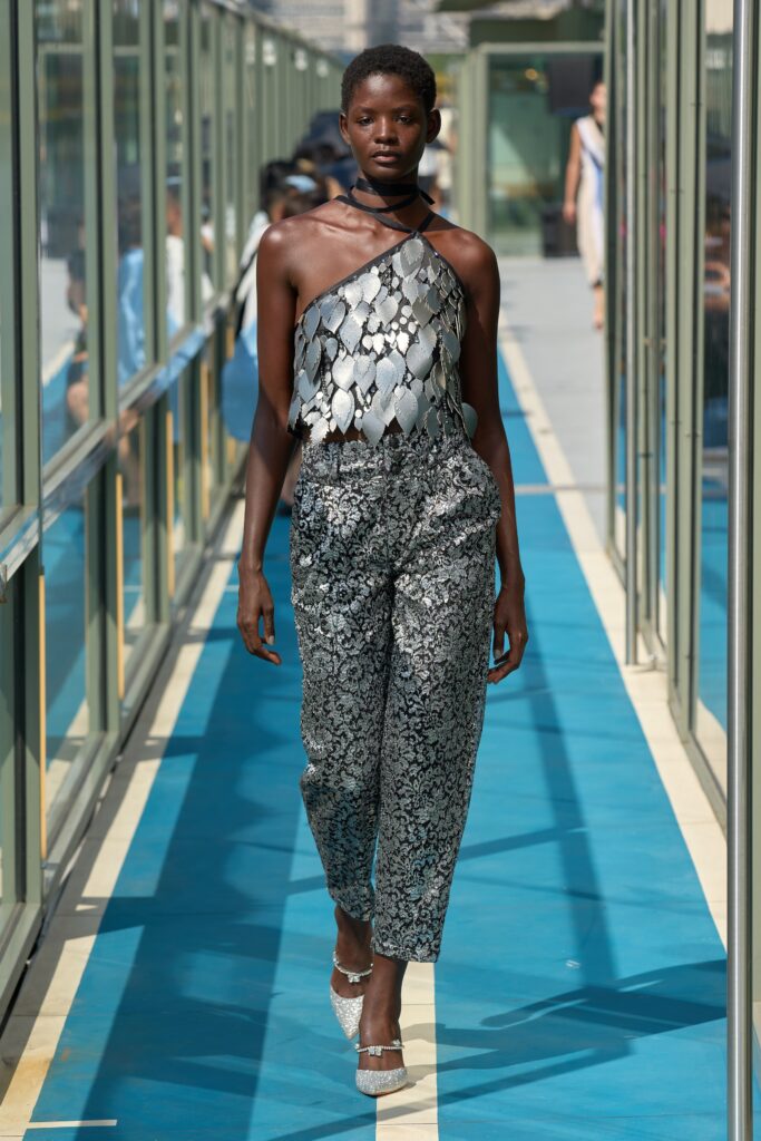 A relaxed silver printed sleeveless top paired with matching relaxed pants for a chic look.