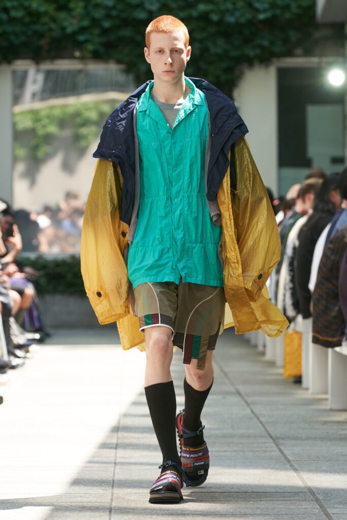 blue vinyl jacket with green shirt