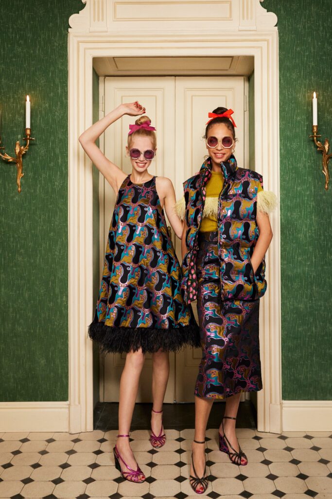 A relaxed multicolor printed dress with a layered design and a collared coat.