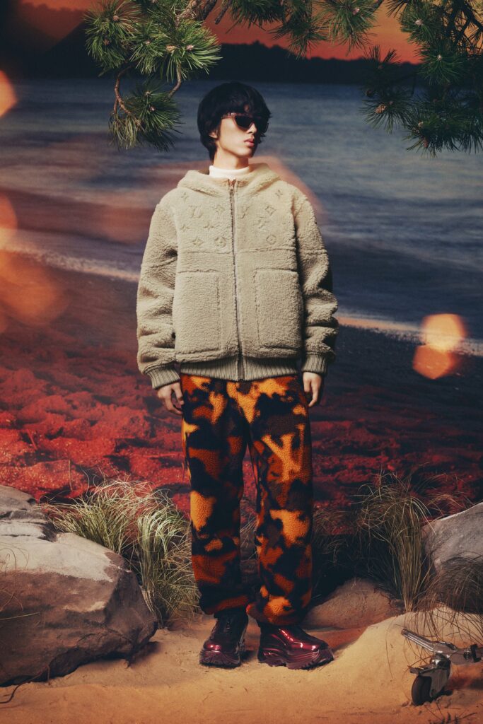 A relaxed brown faux-fur jacket with long sleeves paired with printed pants.
