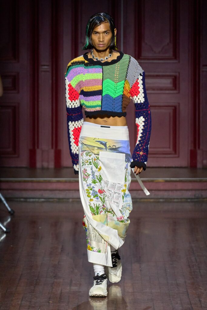 A cropped multicolor top with long sleeves paired with a printed skirt for a unique look.