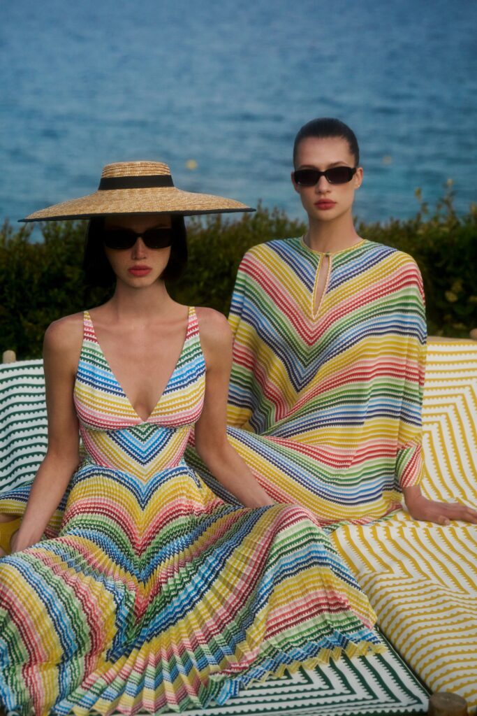 A fitted multicolor sleeveless dress with a V-neckline and flared silhouette.