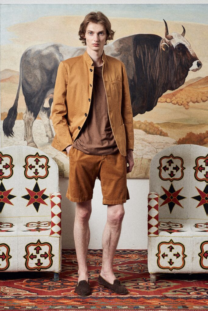 A relaxed brown cotton jacket with a collared design paired with matching shorts.