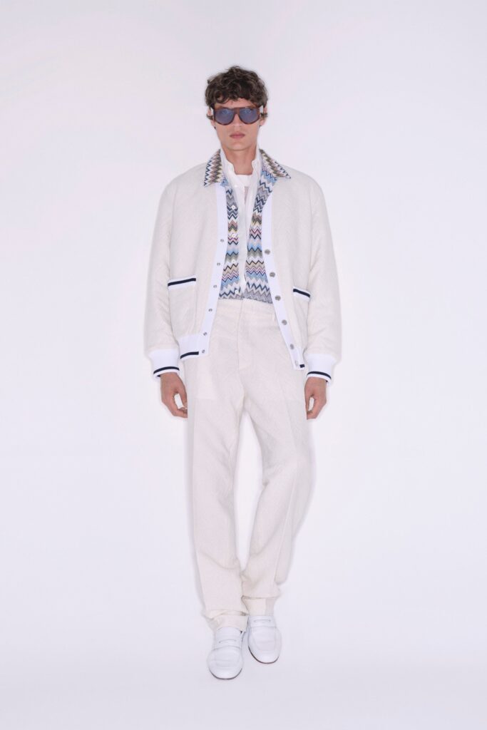 A relaxed white jacket with a collared design paired with matching pants.