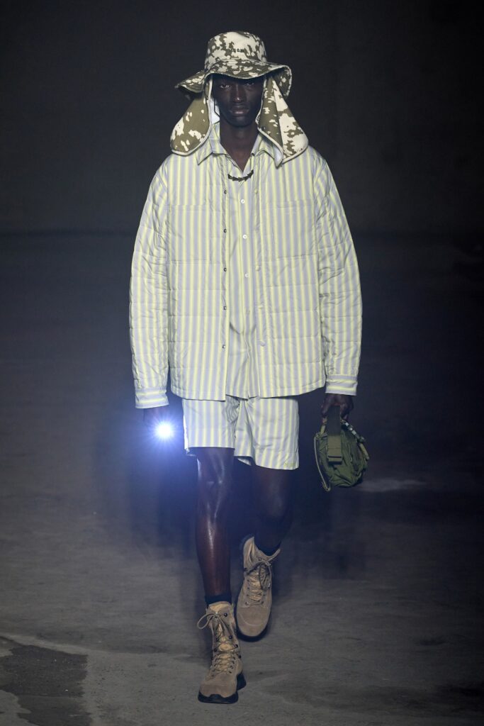An oversized white and blue striped jacket paired with matching shorts for a relaxed look.