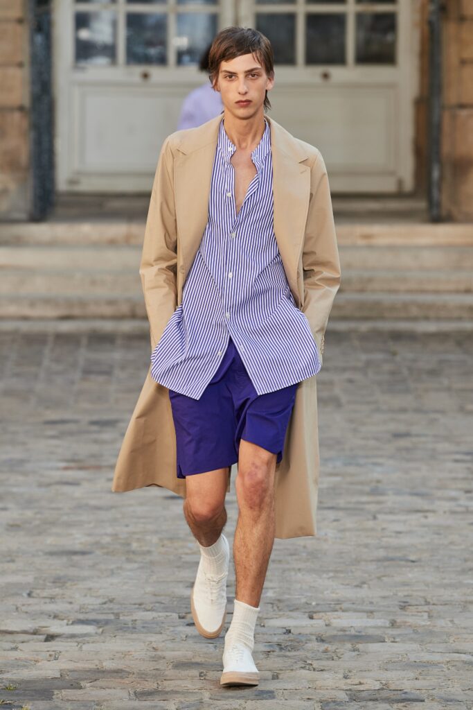 beige coat with blue striped shirt