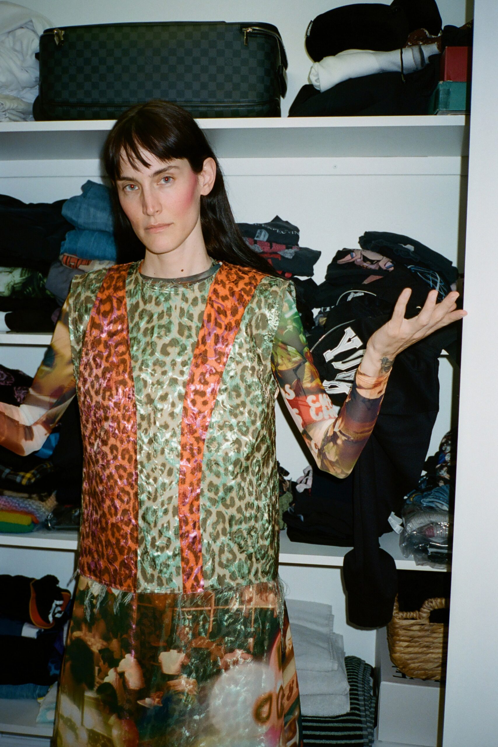 A relaxed multicolor sheer printed dress with a V-neckline and sleeveless design.
