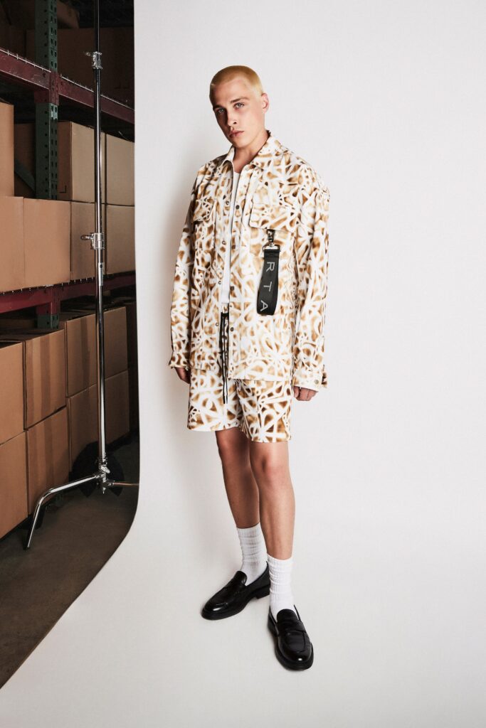 A relaxed beige printed shirt with matching shorts, featuring a collared design.