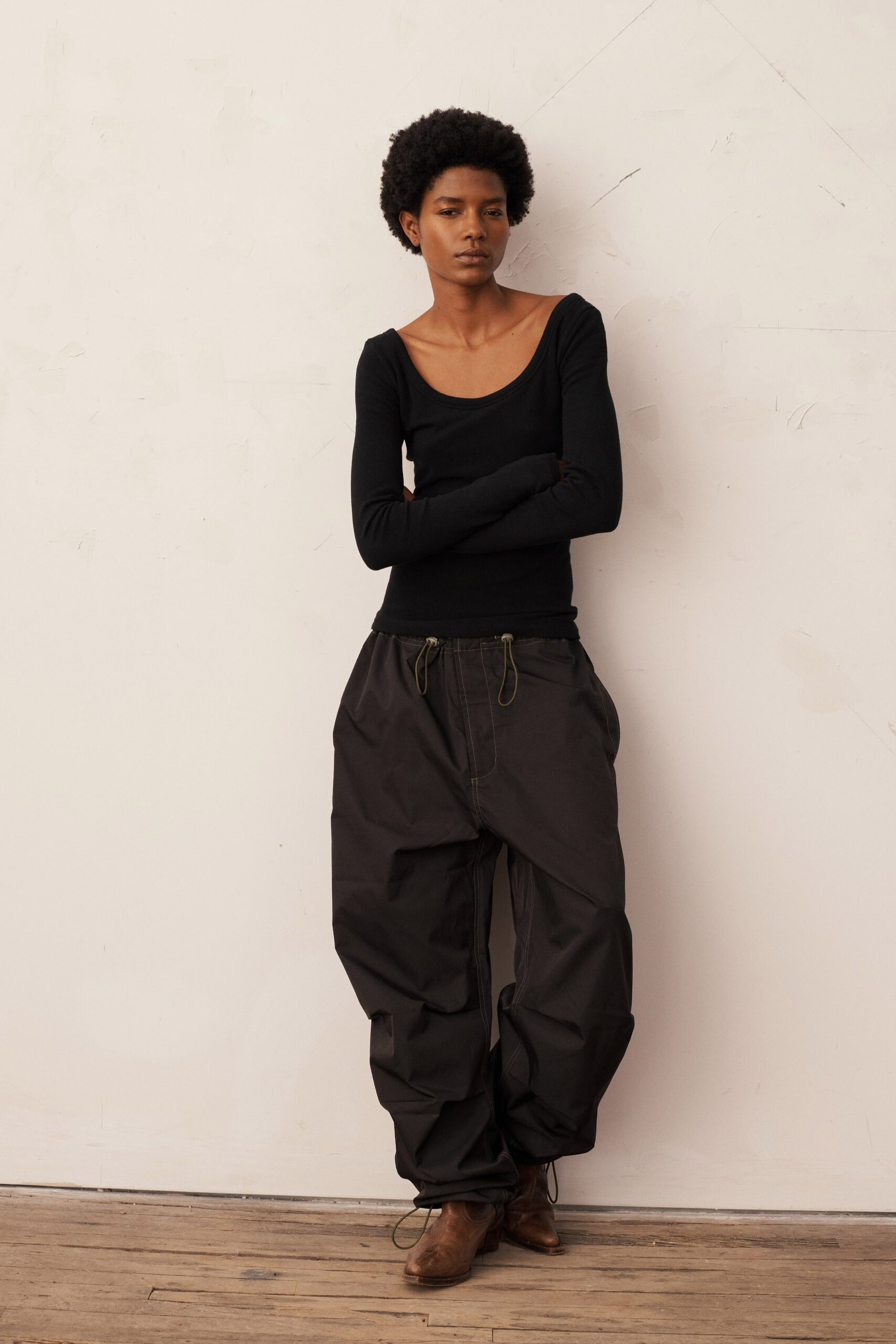 black fitted top and relaxed pants
