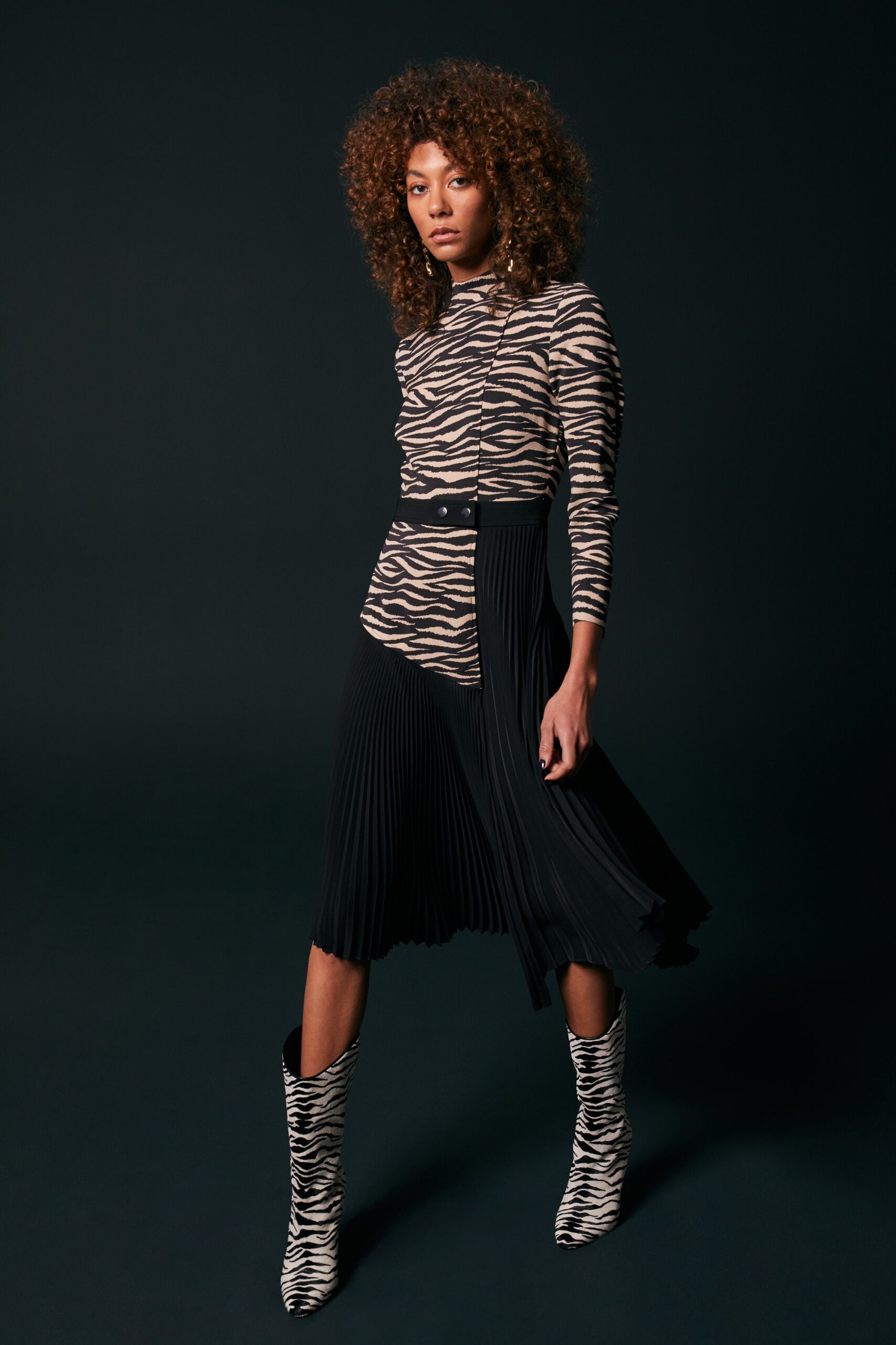 beige striped fitted top with black pleated skirt