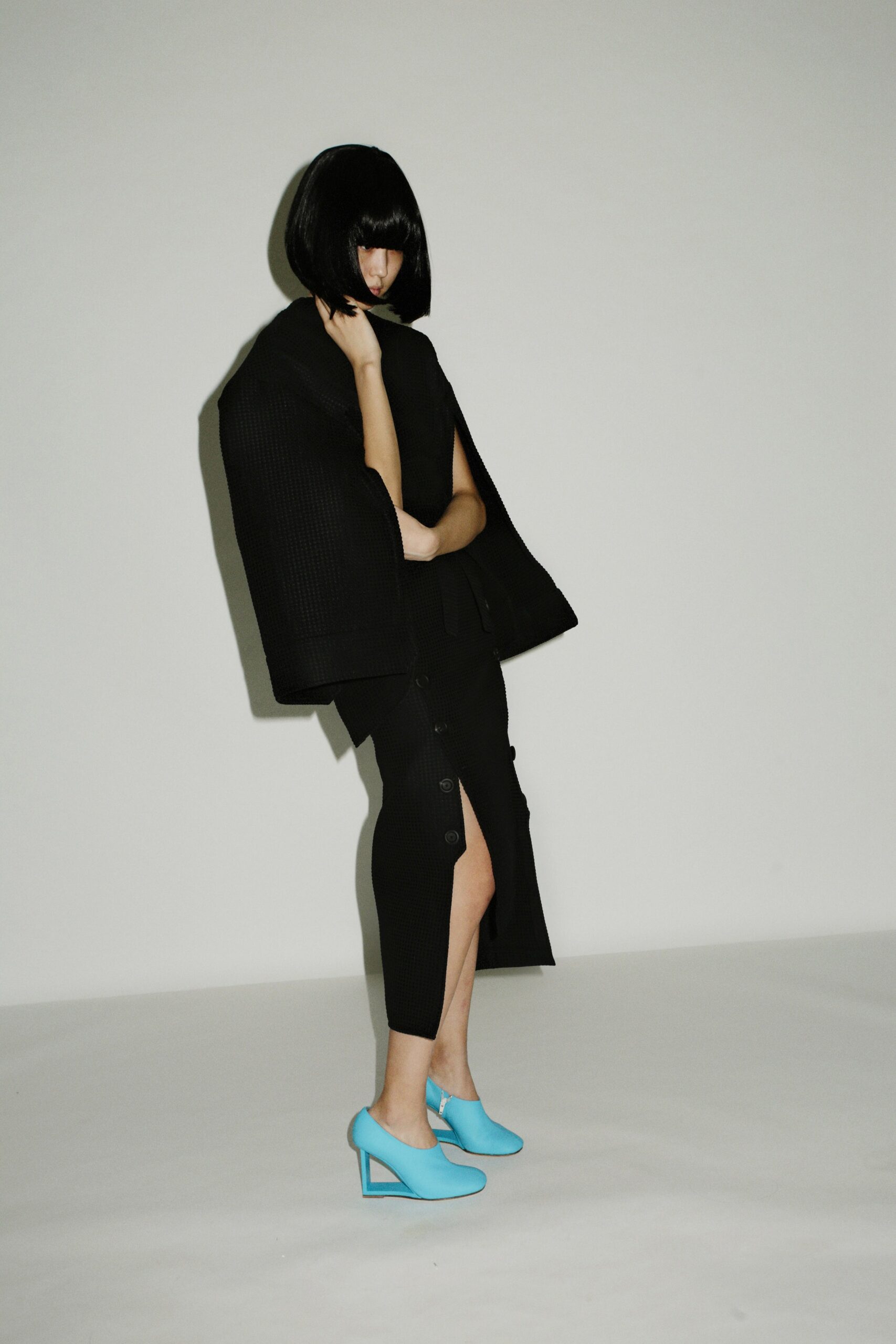 black oversized coat with fitted skirt