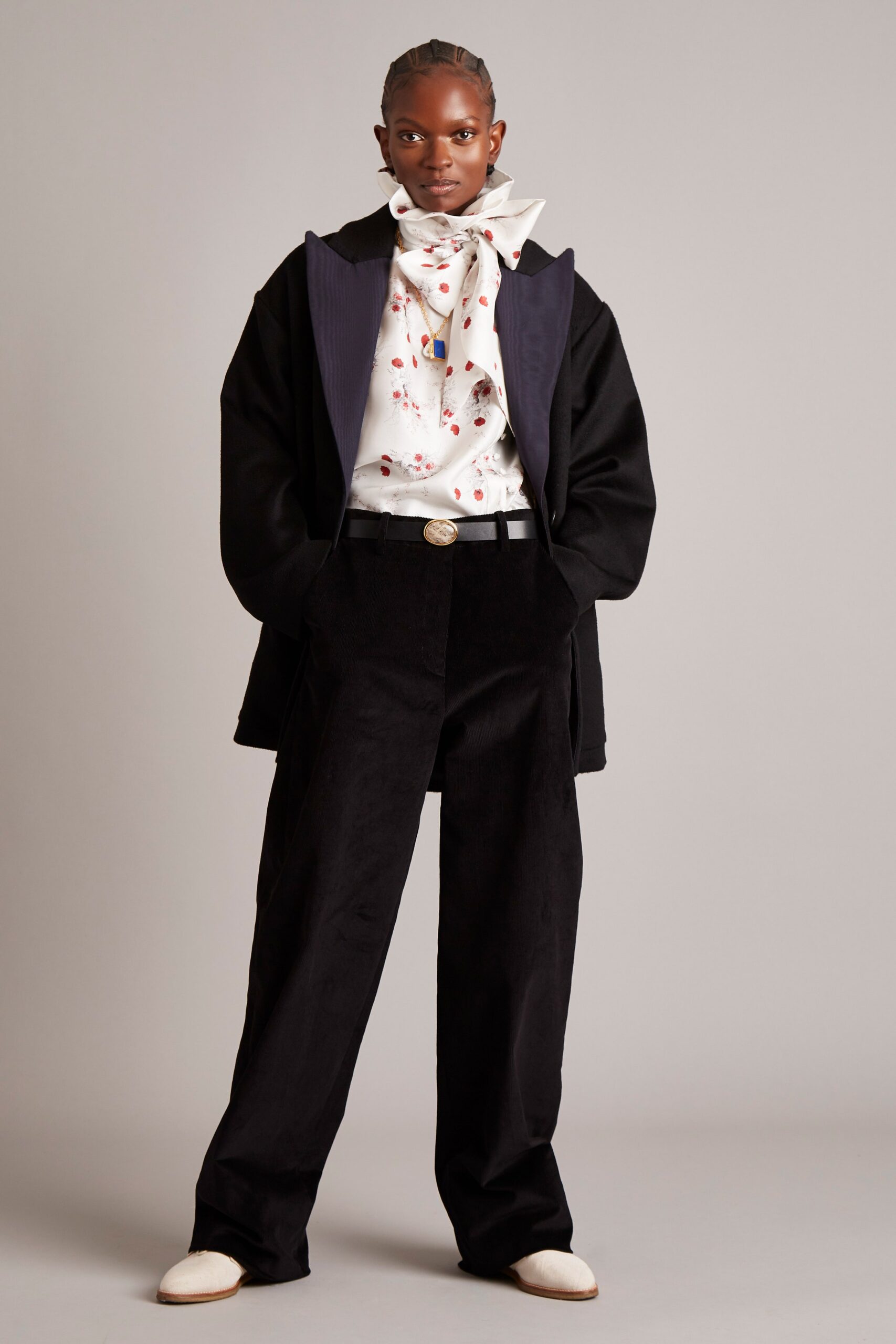 black oversized coat with printed blouse