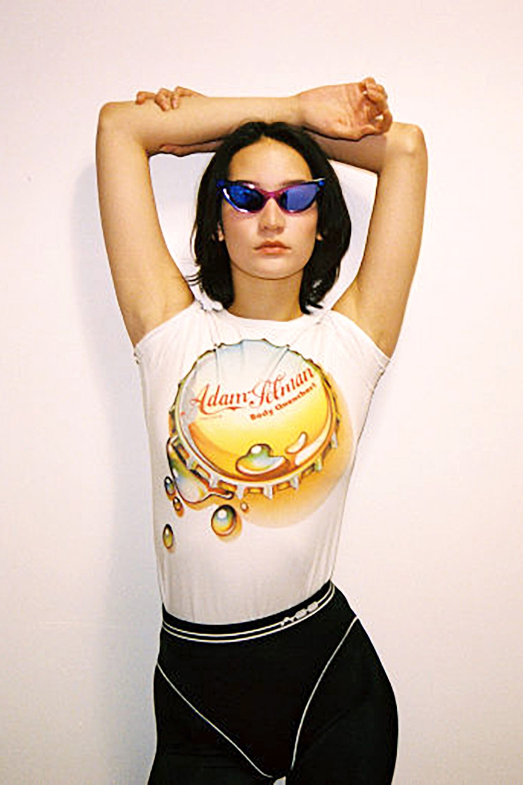 fitted white bodysuit with black pants