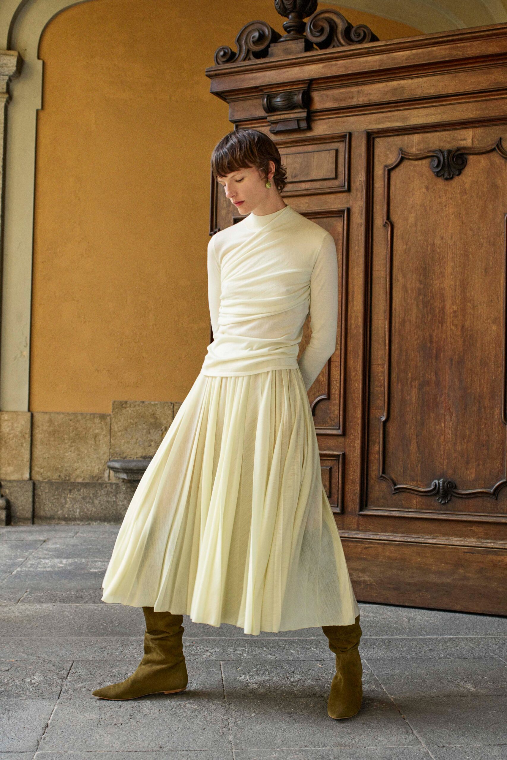 white fitted top cream pleated skirt