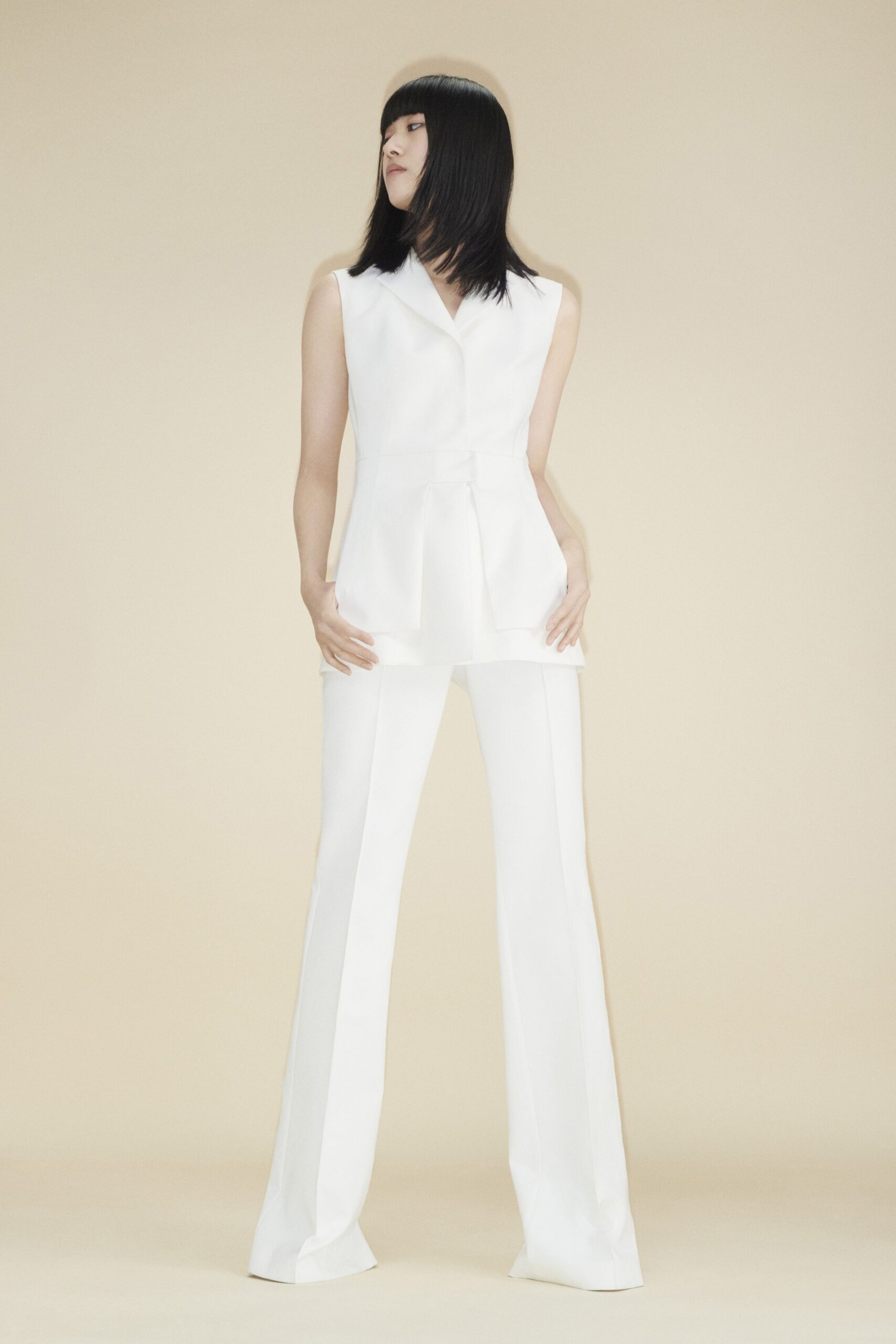 white silk sleeveless v-neck fitted flared top