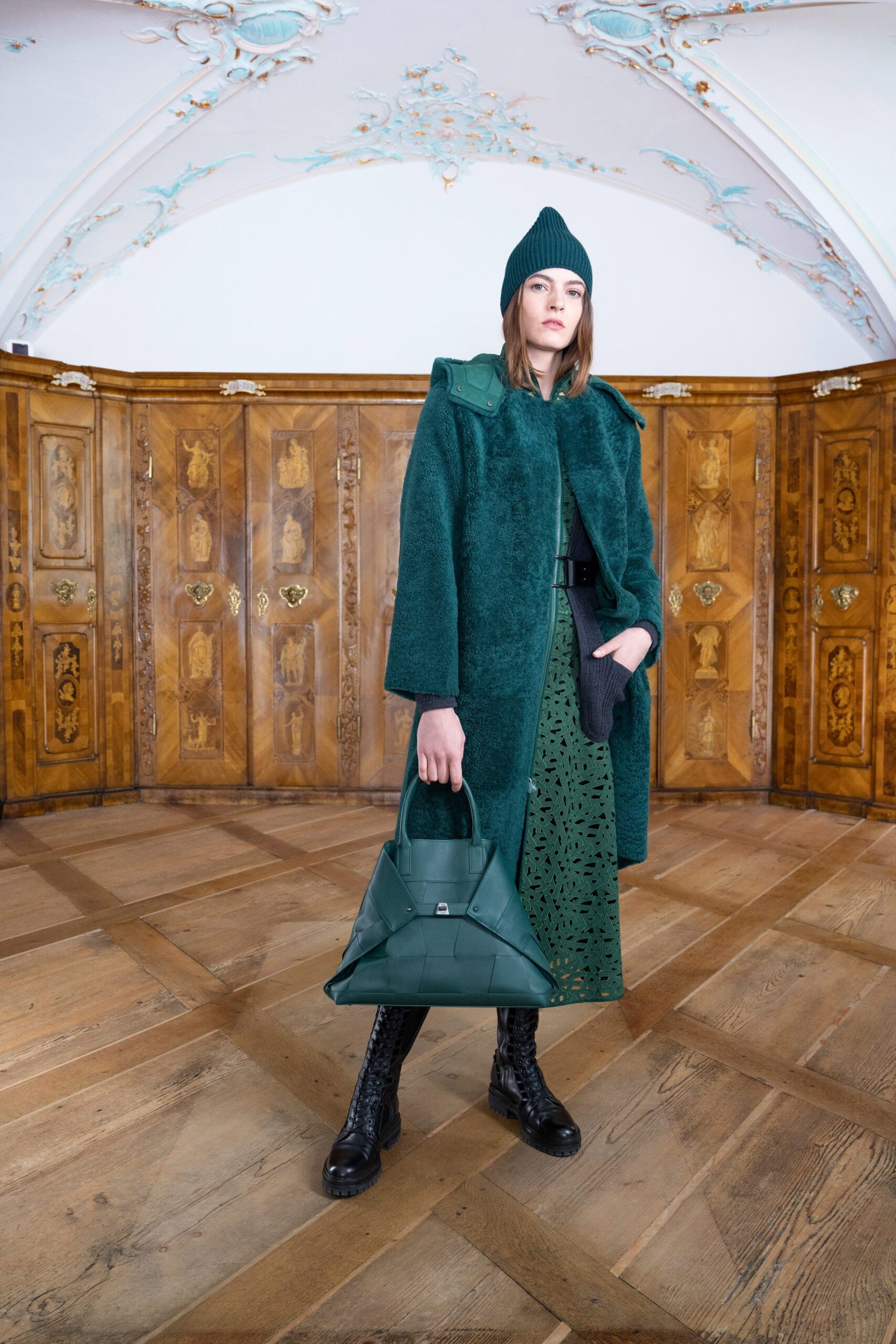green faux-fur coat with pleated skirt