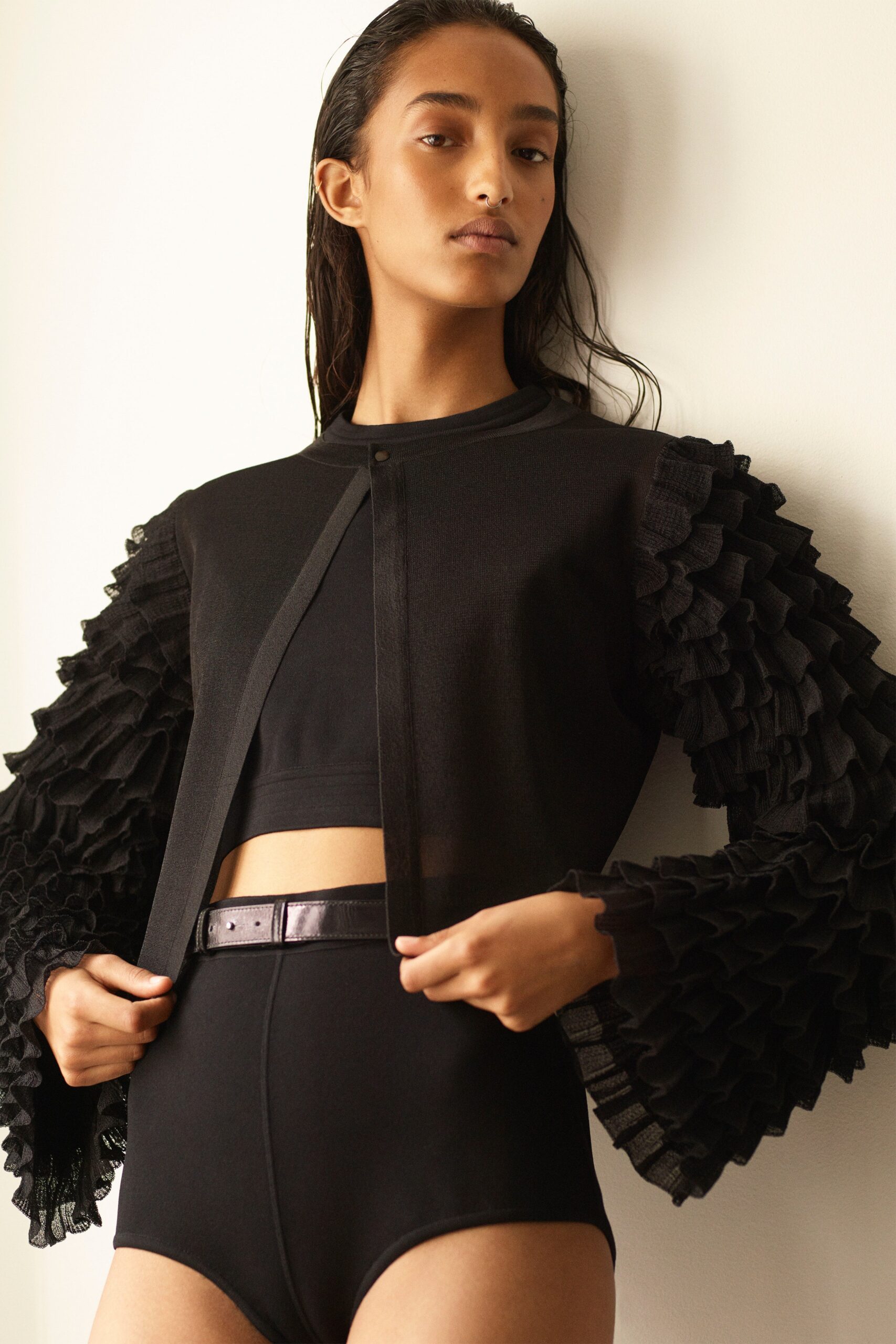 black ruffled top and fitted bottom