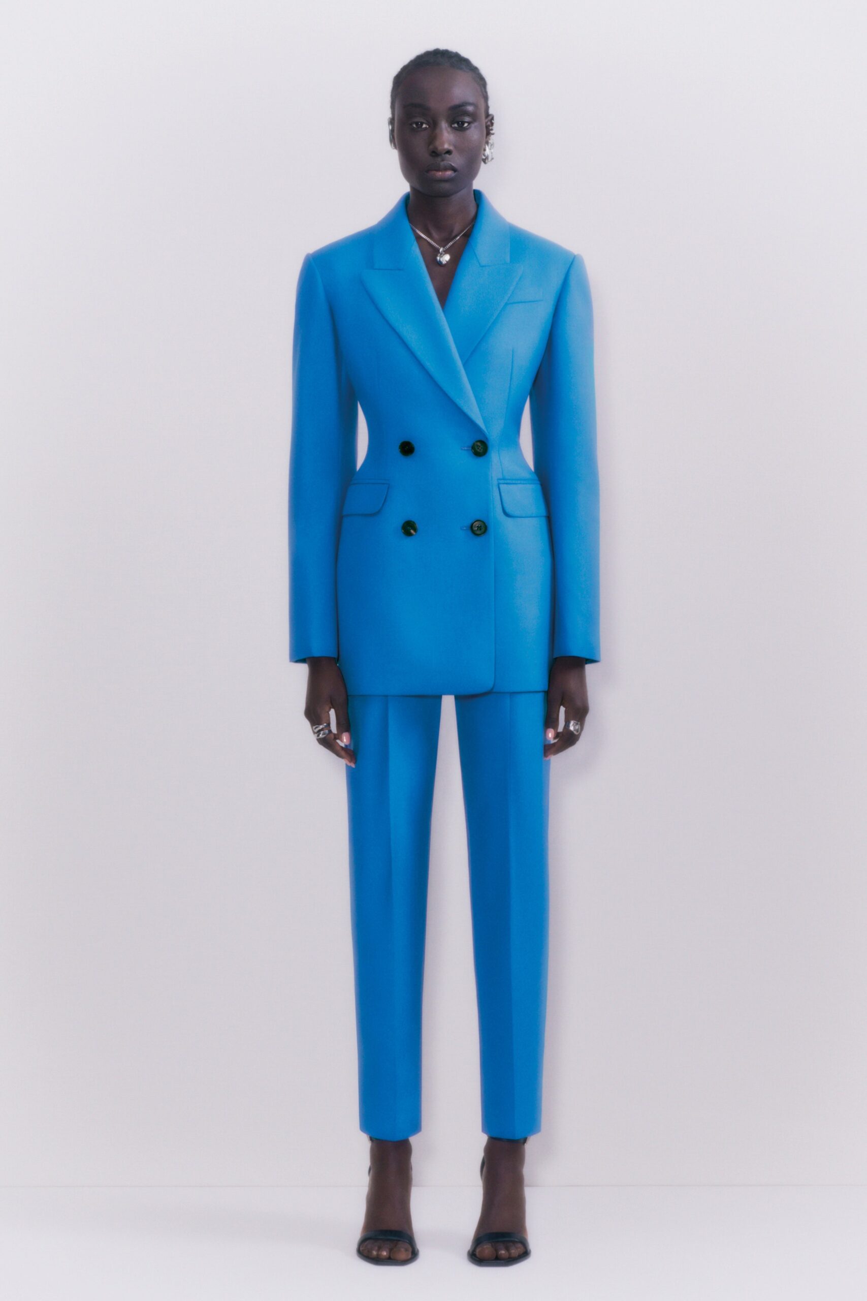 blue tailored suit with black shoes