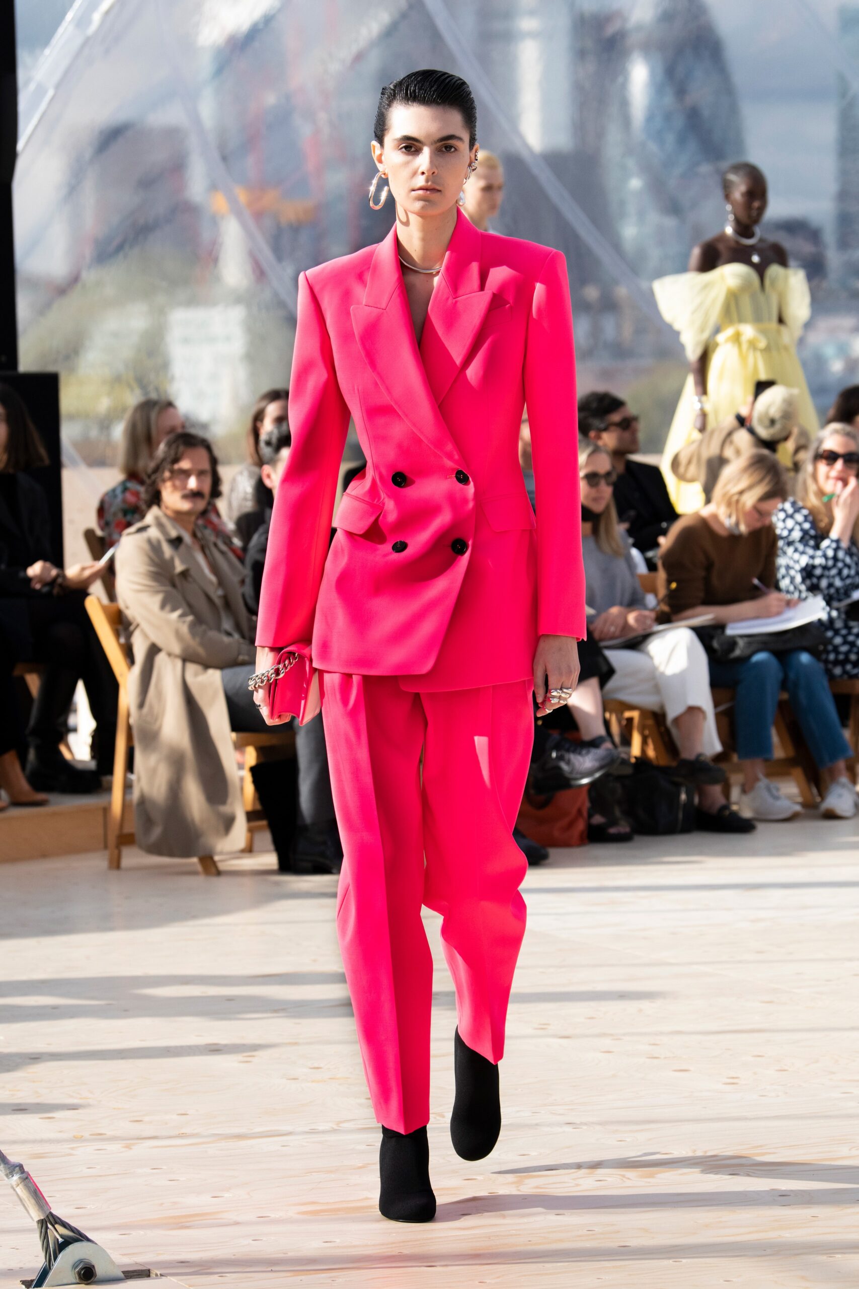 pink tailored suit with black shoes