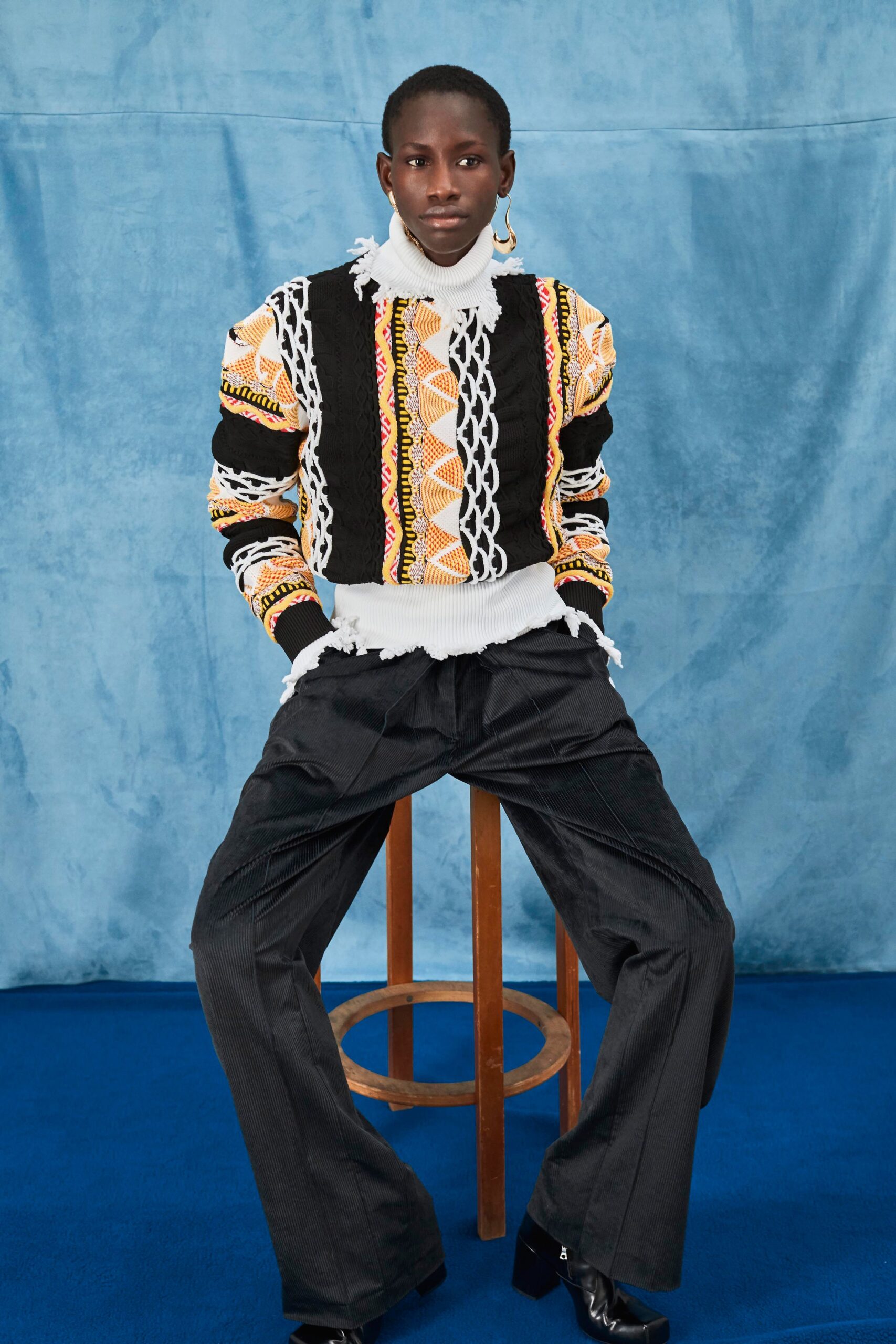 black and white embroidered sweater with relaxed pants