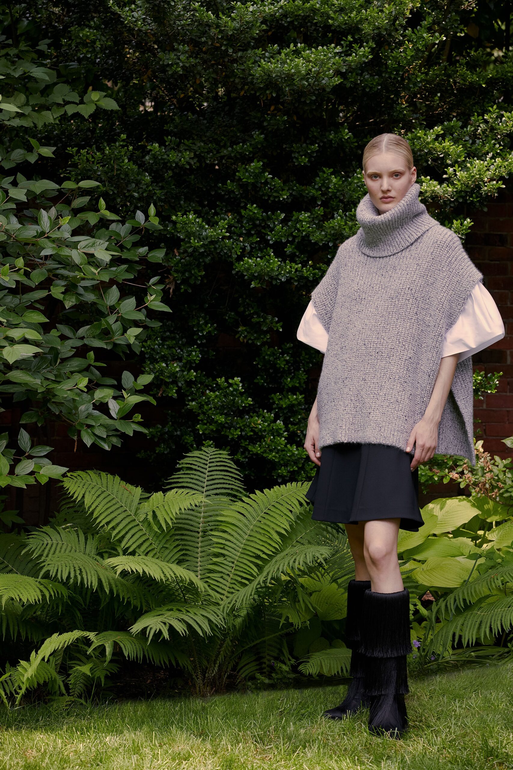 gray wool poncho with white blouse