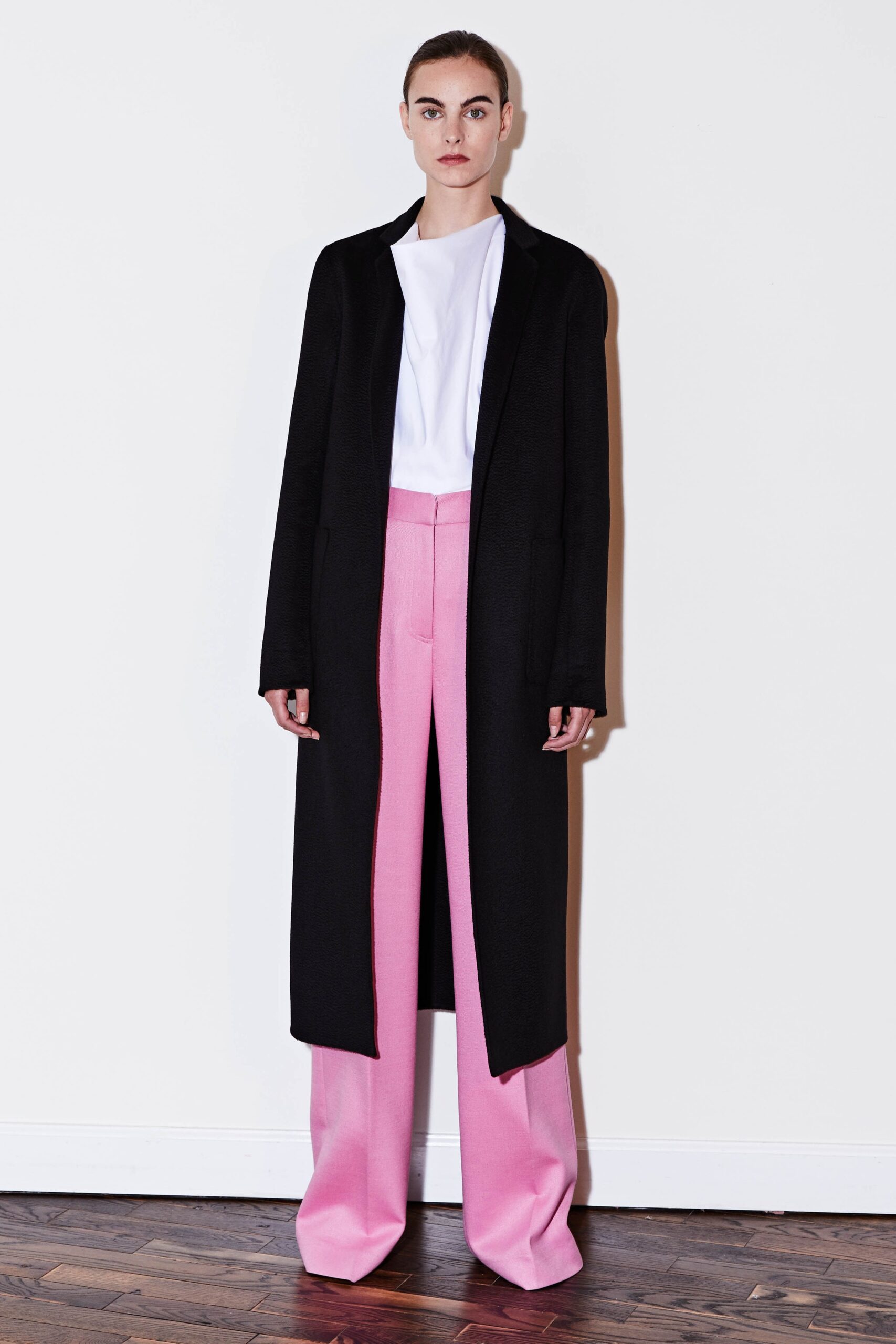 black coat pink wide-leg pants