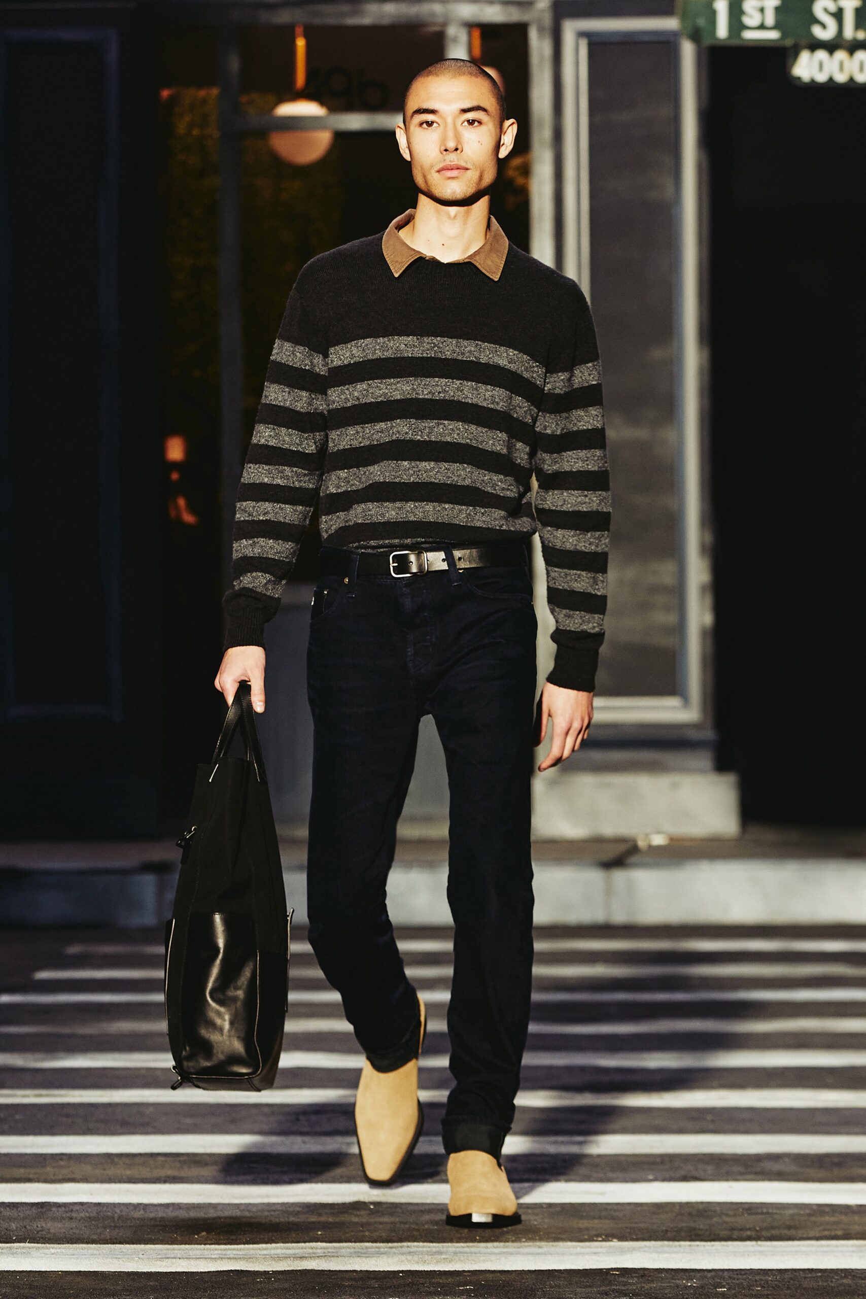 A fitted gray striped sweater with a collared neckline paired with black pants.