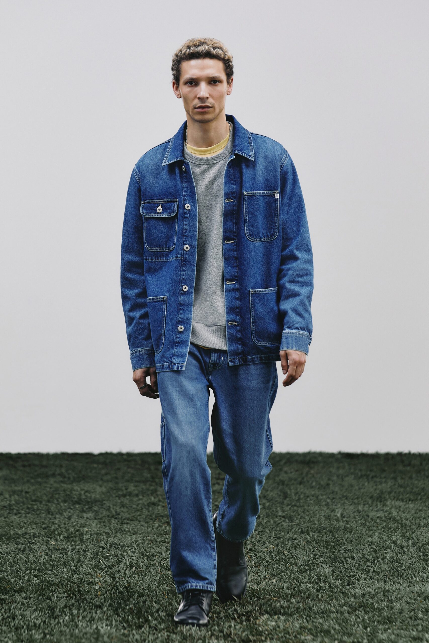 denim jacket gray sweater blue pants