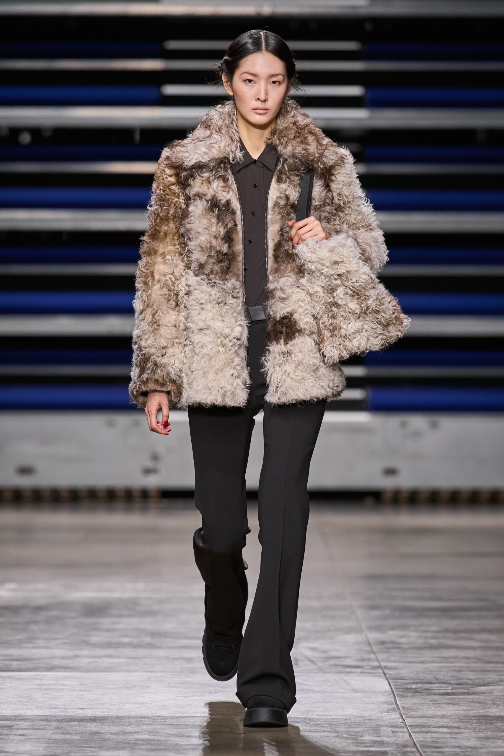 brown fur coat with black shirt and pants