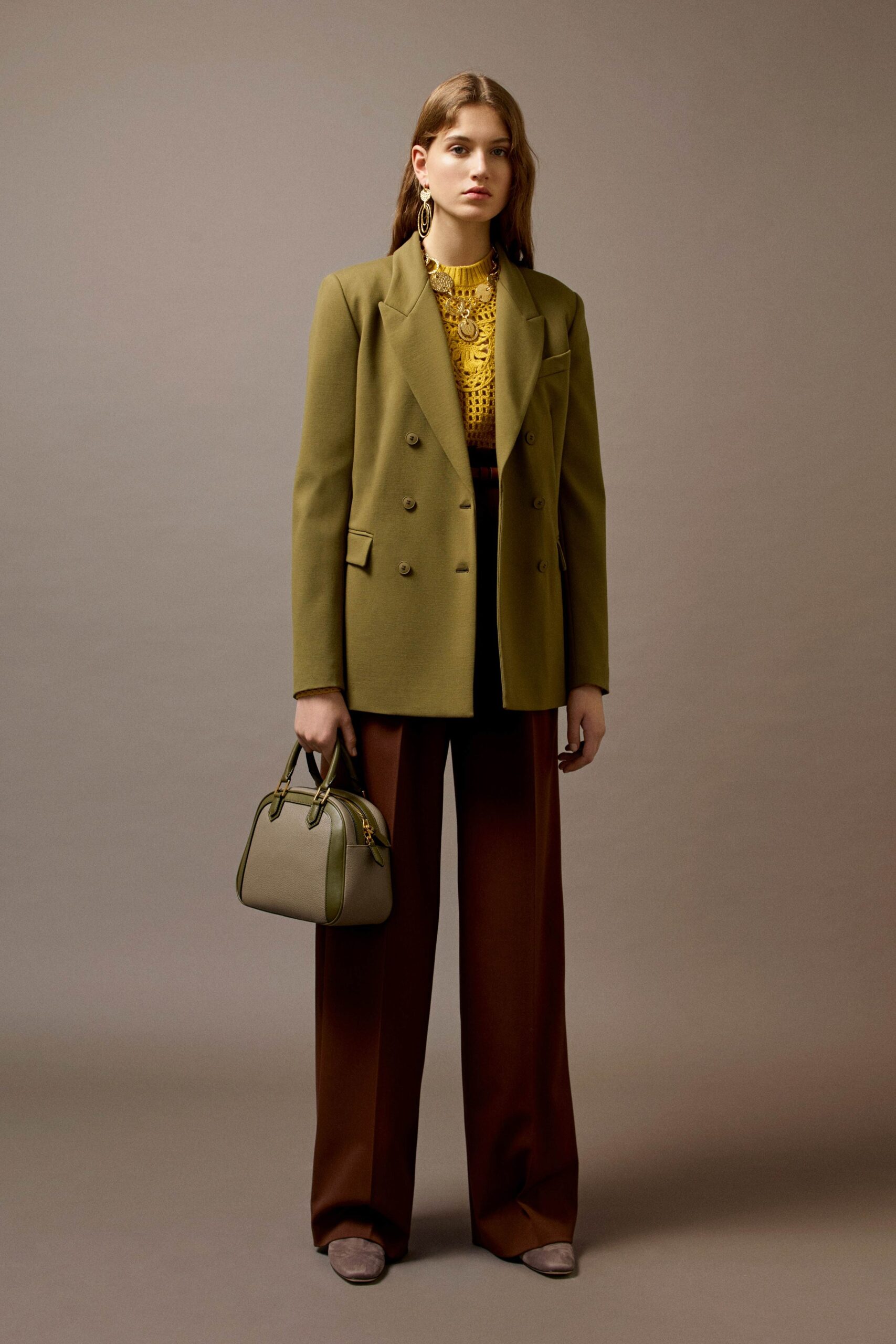 green tailored blazer with yellow top