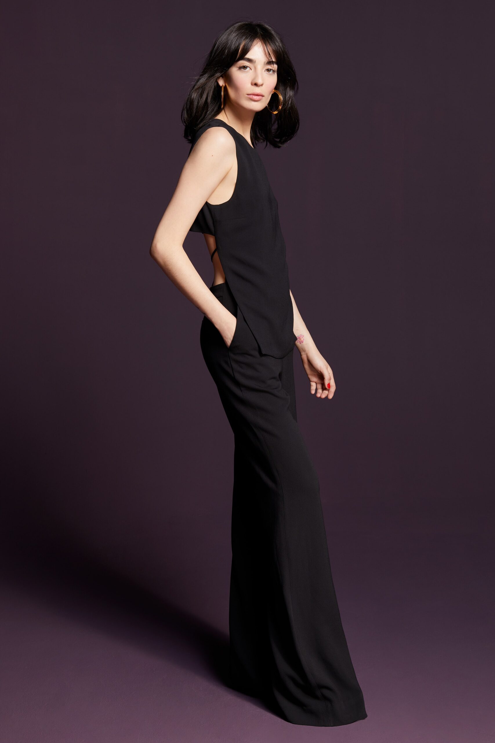 black fitted sleeveless top and flared pants
