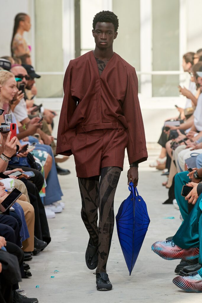 A relaxed brown checked jacket paired with matching shorts, featuring a collared design.