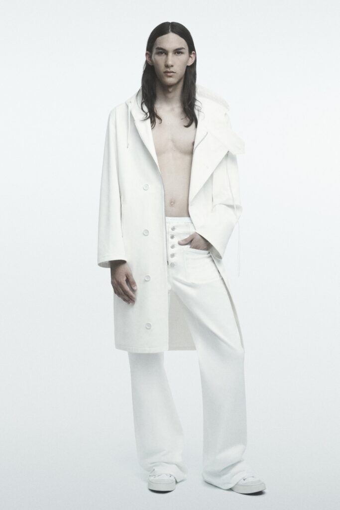 A relaxed white coat with long sleeves and wide-leg pants, featuring a collared design.