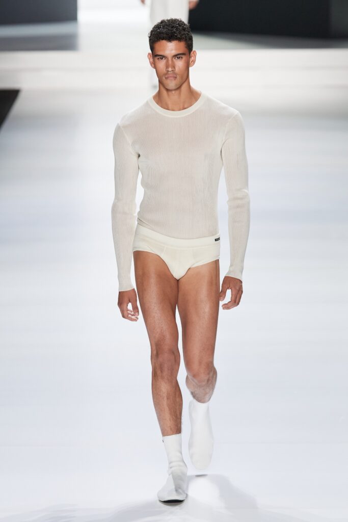 A fitted white ribbed long-sleeve shirt paired with matching underwear.