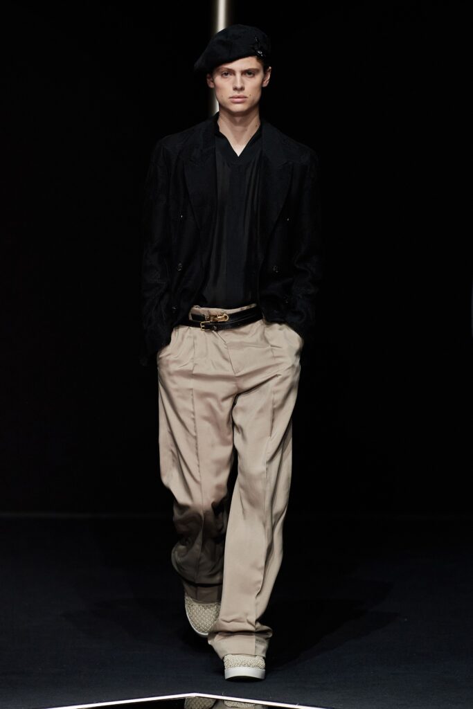 black blazer and beige pants