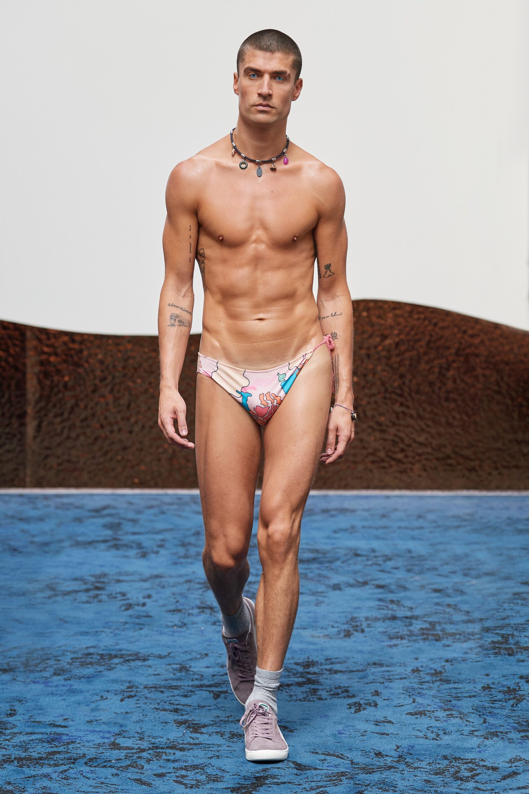 A fitted pink bikini with a printed design, perfect for summer beachwear.