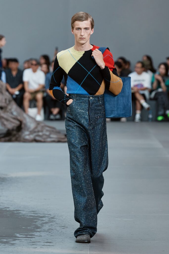 A relaxed fit colorful sweater with long sleeves paired with high-waisted pants.