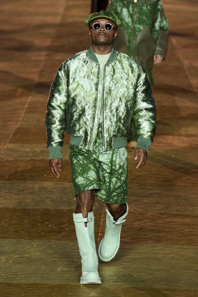 A relaxed-fit green printed jacket paired with matching shorts, showcasing a contemporary streetwear style.