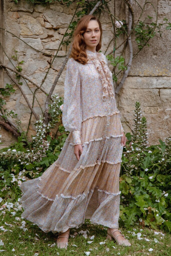 A relaxed multicolor floral dress with long sleeves and a tiered design.