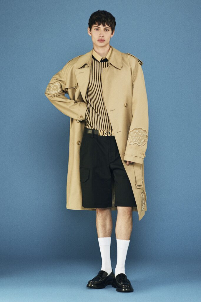 beige trench coat with black shirt and shorts