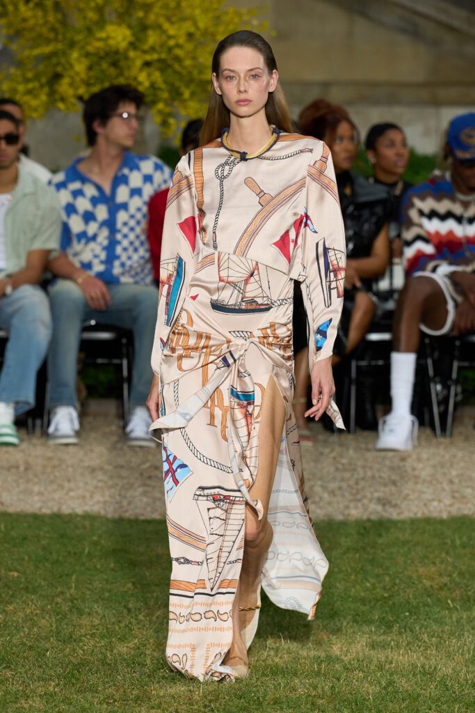 A relaxed multicolor long-sleeve dress with a V-neckline and asymmetric design details.