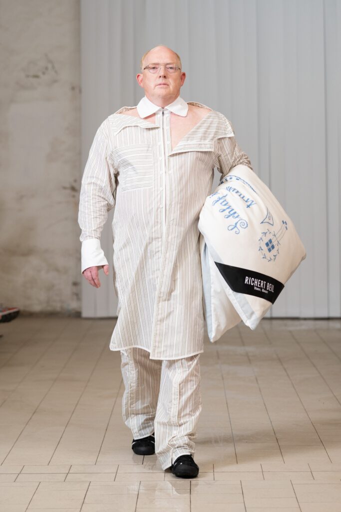 A white and gray striped cotton shirt paired with matching pants, featuring a buttoned front and long sleeves.