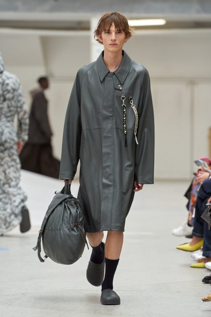 A relaxed gray leather coat with a collared neckline and buttoned details.