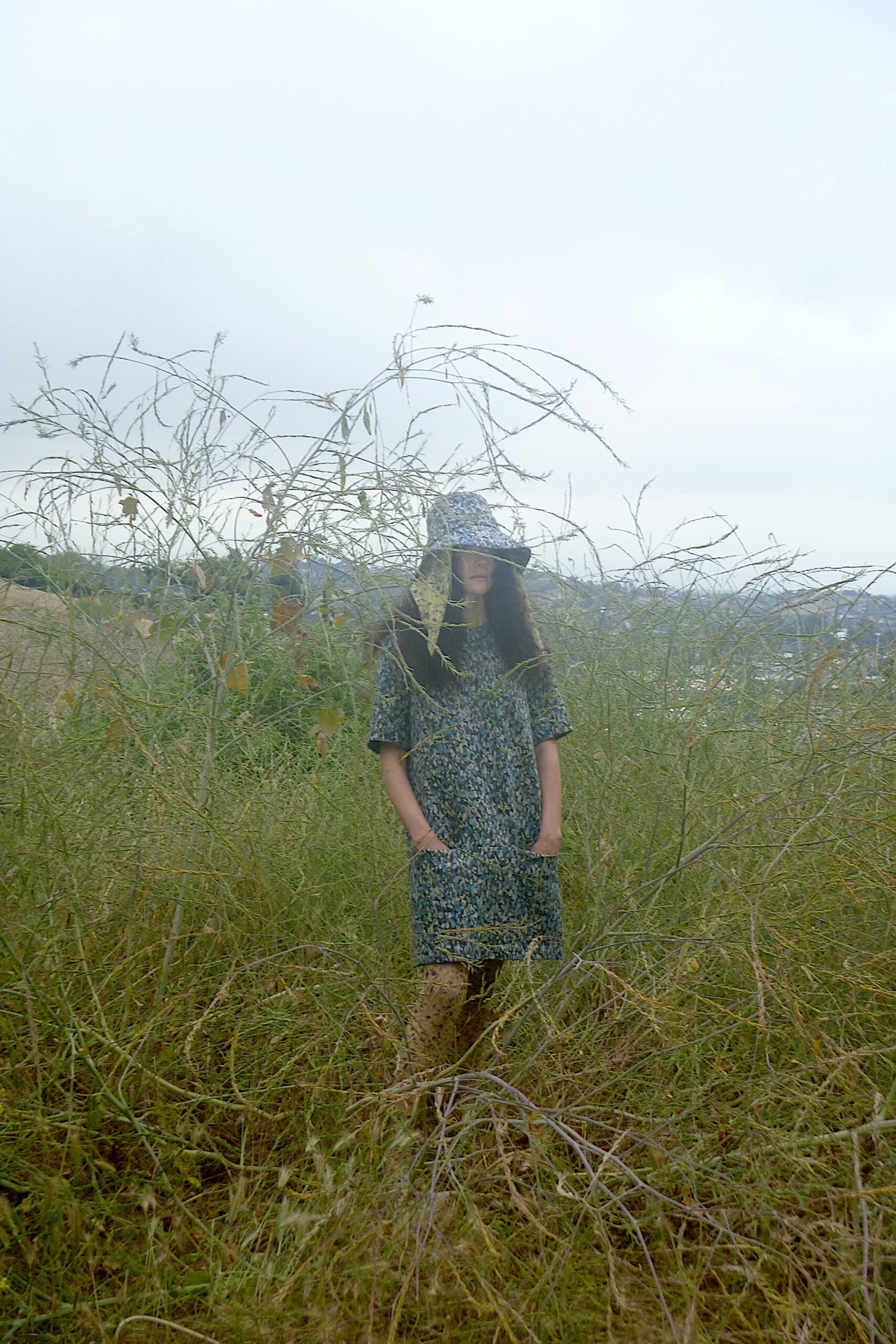 A relaxed multicolor cotton dress with short sleeves and a collared neckline featuring a printed design.