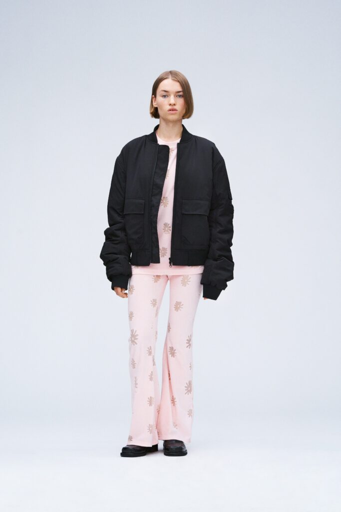 black oversized jacket with pink flared pants