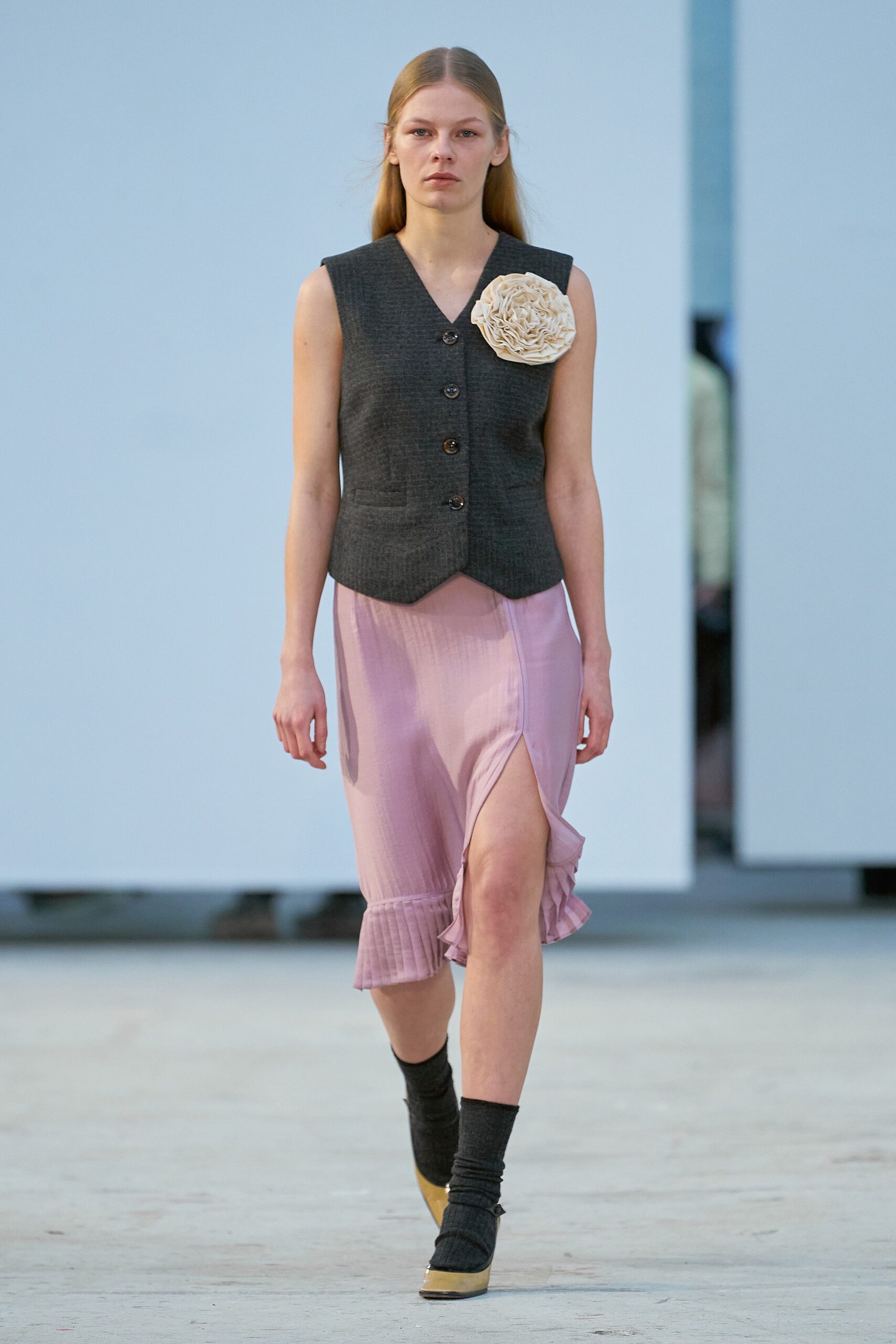 black vest and pink midi dress