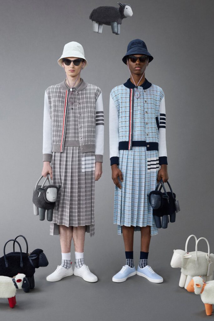 A relaxed gray and blue checked dress with a collared neckline and short sleeves.