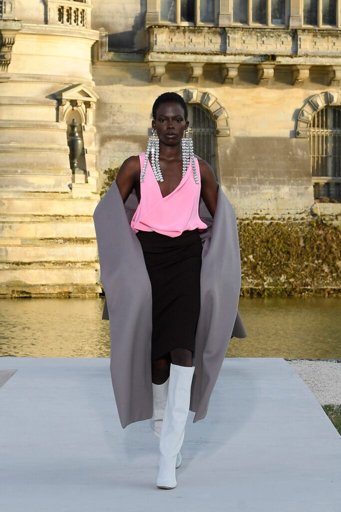 gray coat pink top black skirt